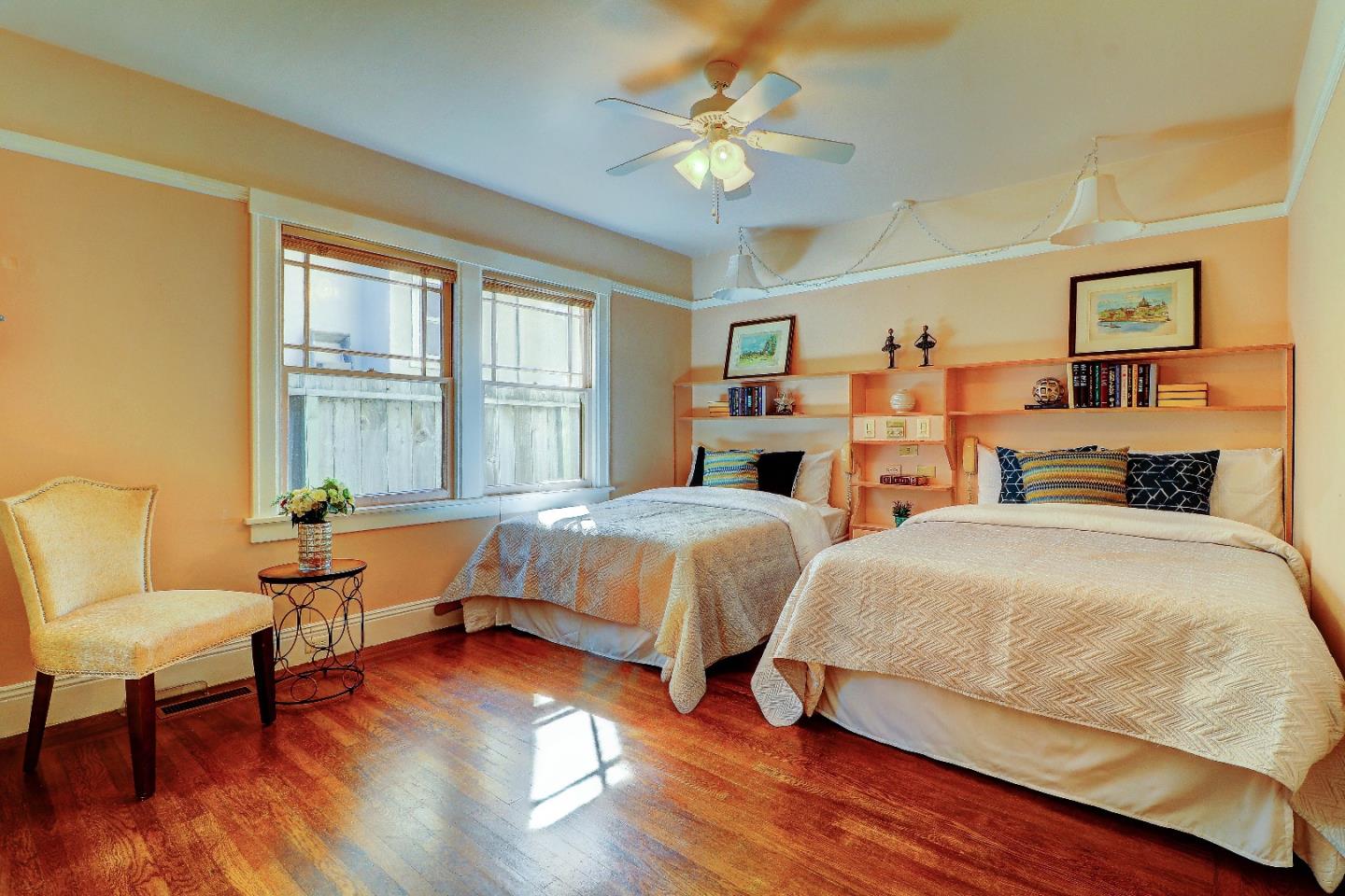2701 Hillside Drive Burlingame, CA 94010 - Photo 25 of 50 a spacious bedroom with two beds and a chair