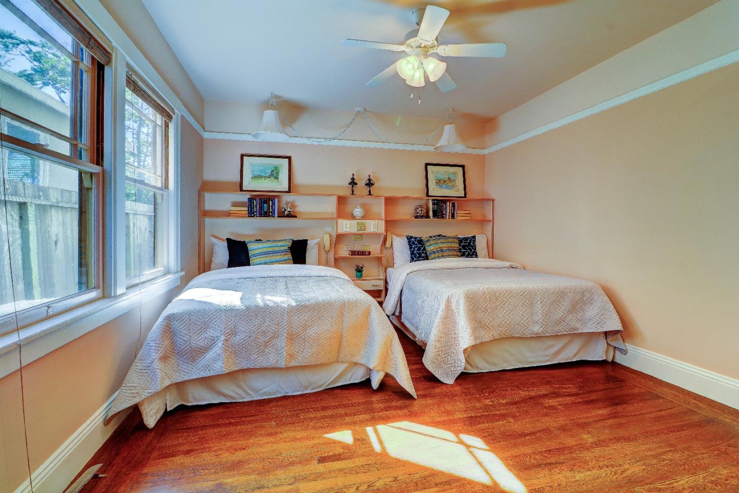 2701 Hillside Drive Burlingame, CA 94010 - Photo 26 of 50 a bedroom with two beds and a chandelier