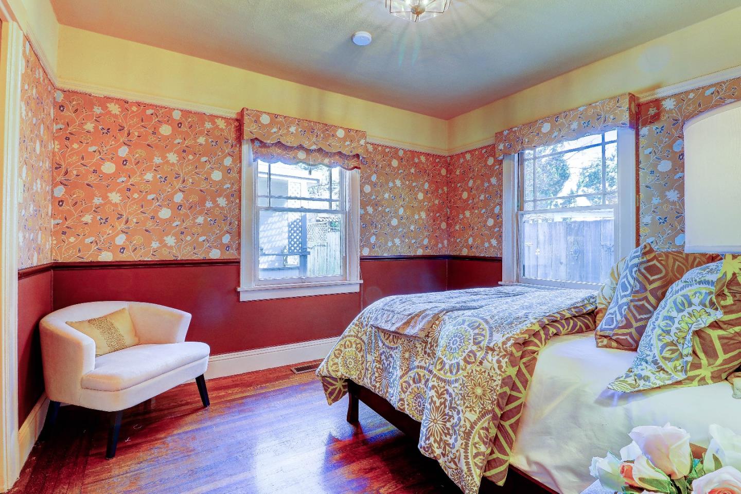 2701 Hillside Drive Burlingame, CA 94010 - Photo 27 of 50 a bedroom with a bed and wooden floor