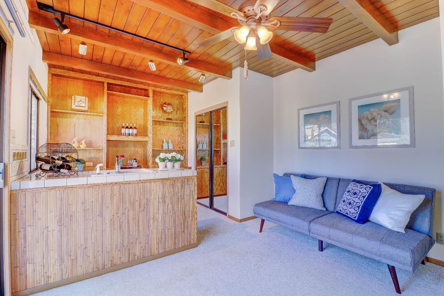 2701 Hillside Drive Burlingame, CA 94010 - Photo 33 of 50 a living room with furniture and a large window