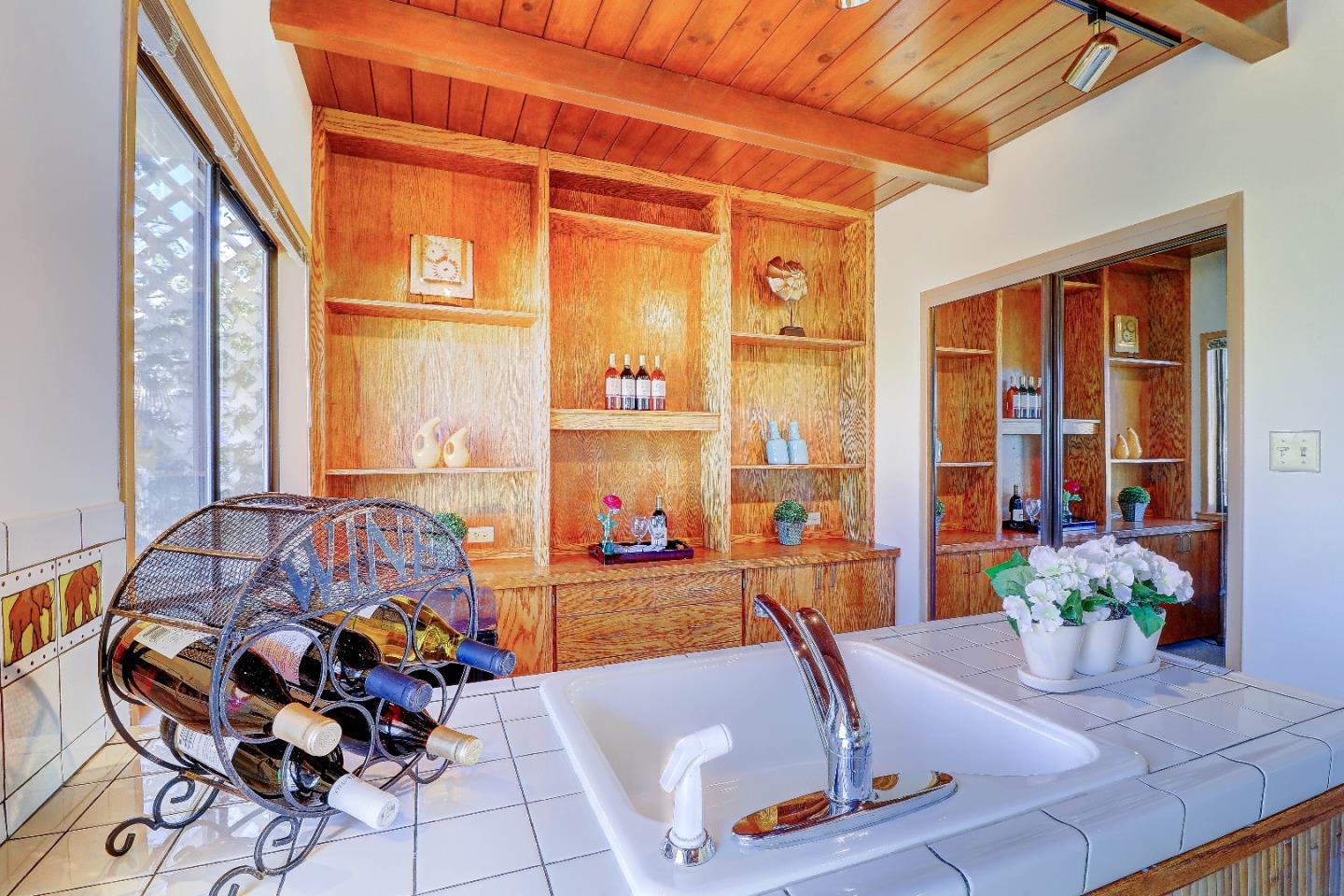2701 Hillside Drive Burlingame, CA 94010 - Photo 36 of 50 a living room with furniture and floor to ceiling windows