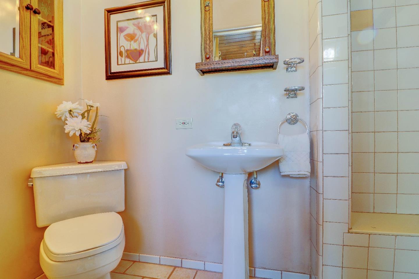 2701 Hillside Drive Burlingame, CA 94010 - Photo 37 of 50 a bathroom with a toilet sink and mirror