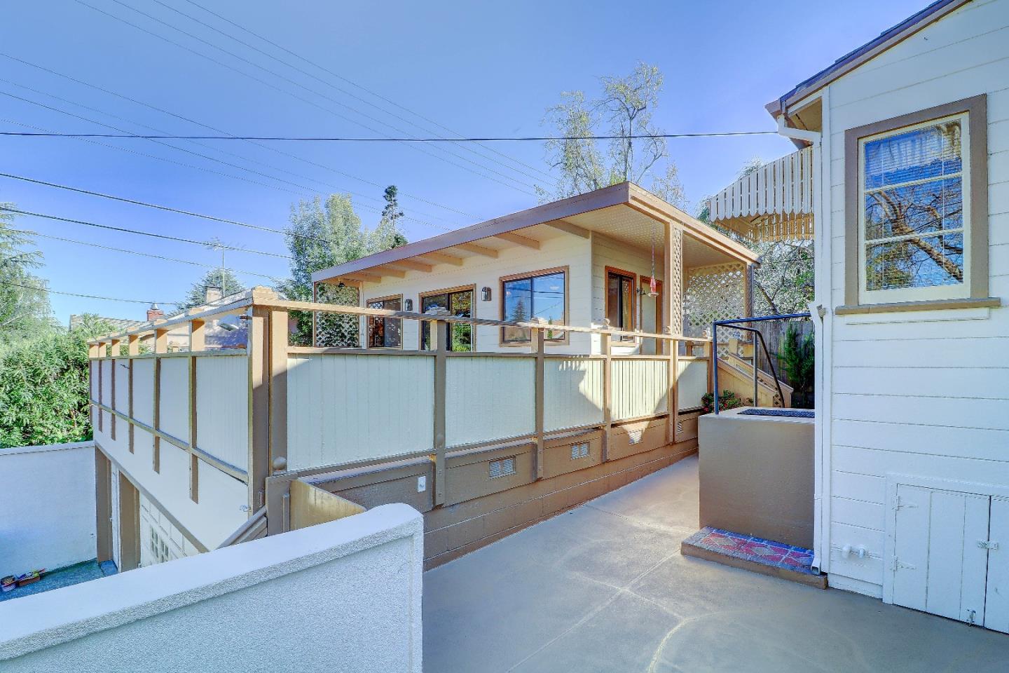 2701 Hillside Drive Burlingame, CA 94010 - Photo 41 of 50 a view of a house with roof and wooden fence
