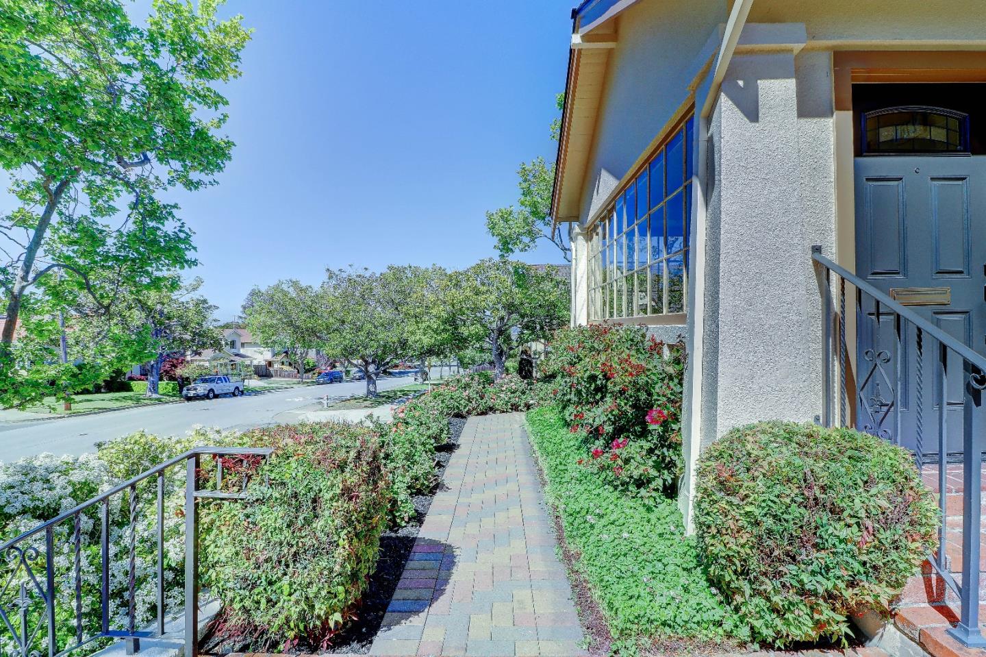2701 Hillside Drive Burlingame, CA 94010 - Photo 47 of 50 a view of a pathway with house on both side