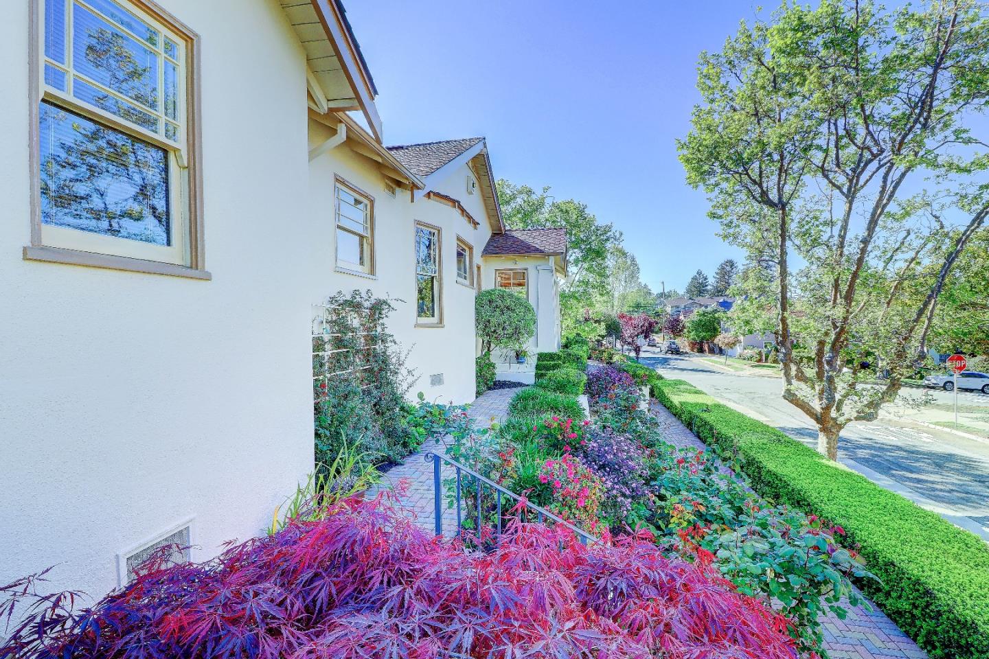 2701 Hillside Drive Burlingame, CA 94010 - Photo 50 of 50 a front view of a house with a yard and fountain