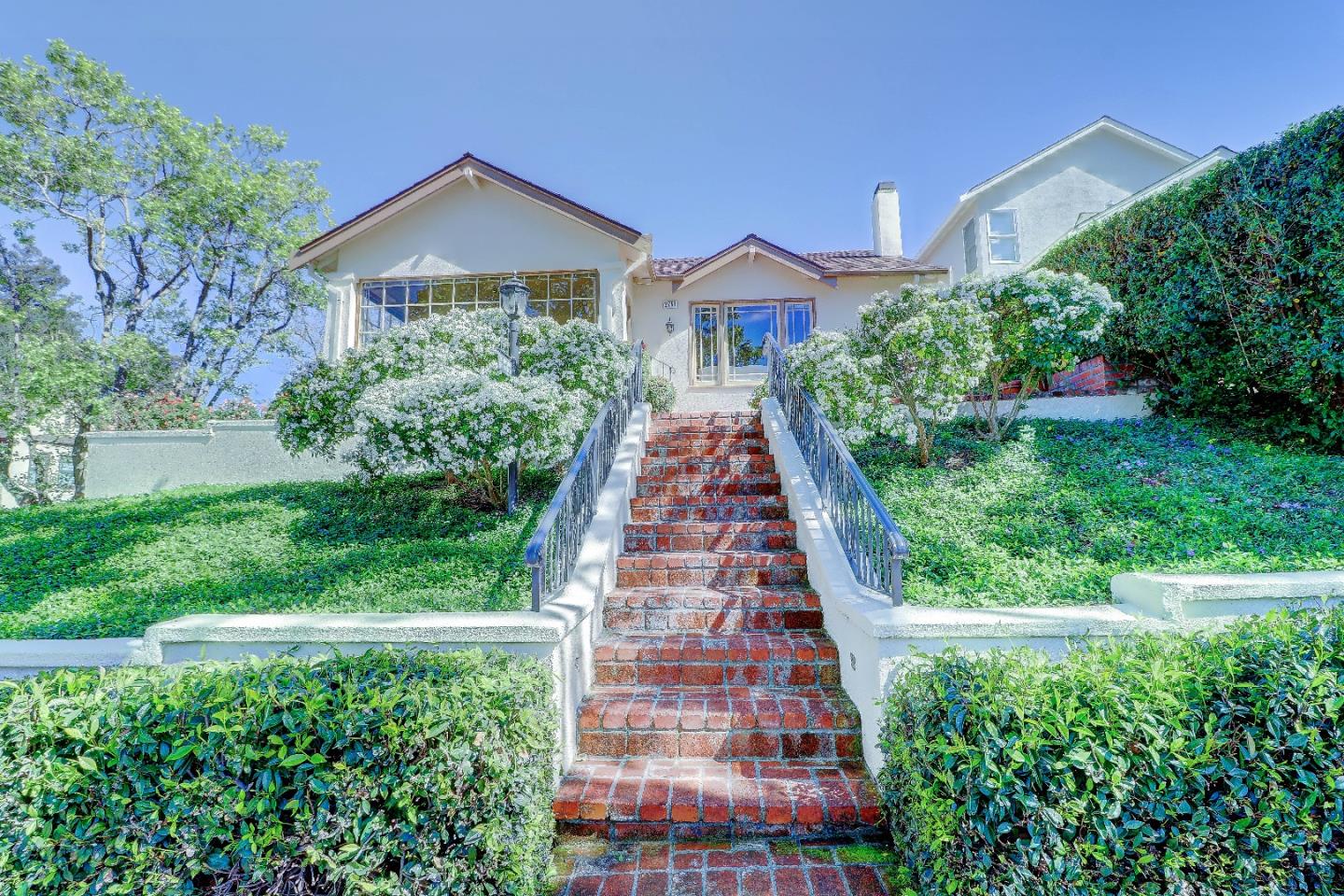 2701 Hillside Drive Burlingame, CA 94010 - Photo 5 of 50 a front view of a house with a yard