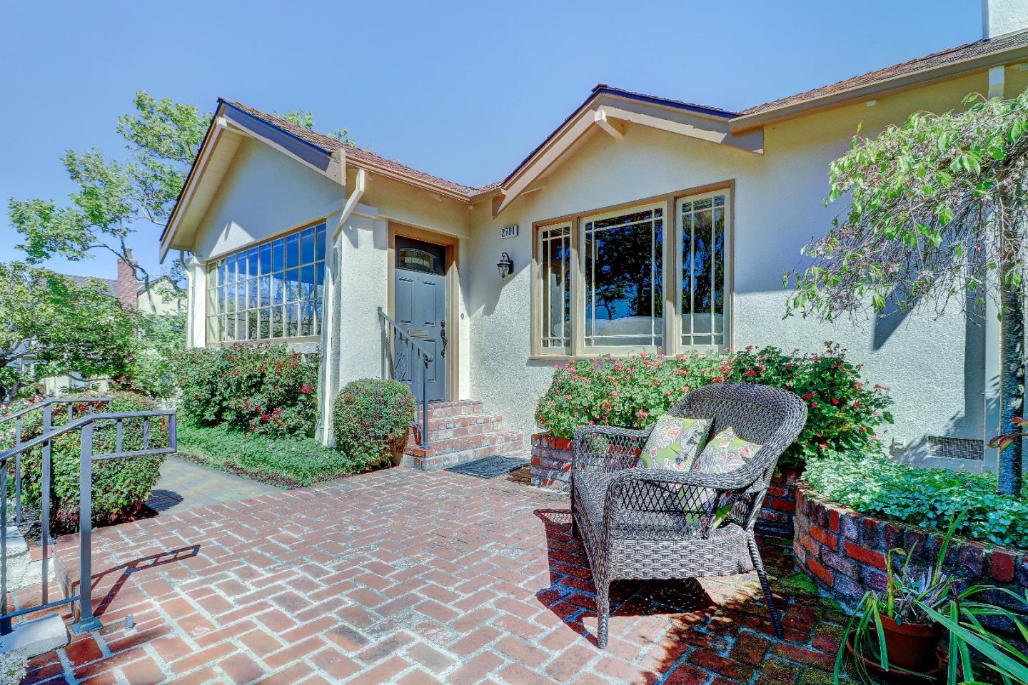2701 Hillside Drive Burlingame, CA 94010 - Photo 7 of 50 a view of a chair and table in backyard of the house