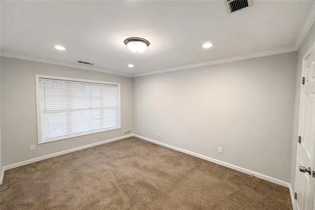 an empty room with a empty space and window