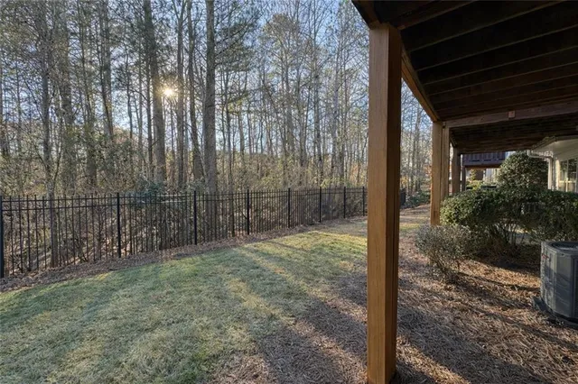 a view of a backyard with pathway