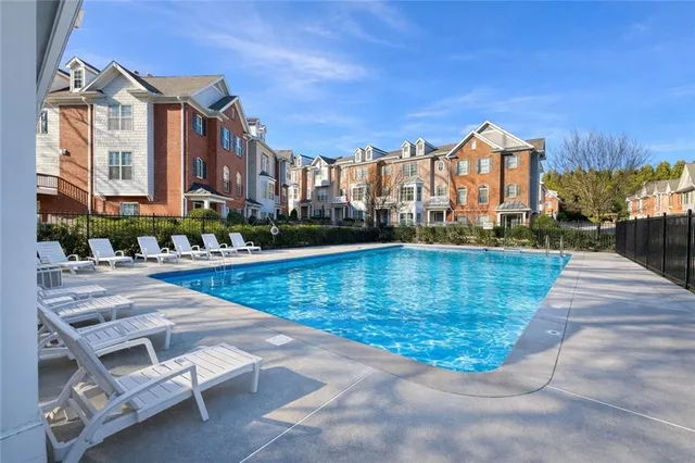 a view of a swimming pool with a lounge chairs