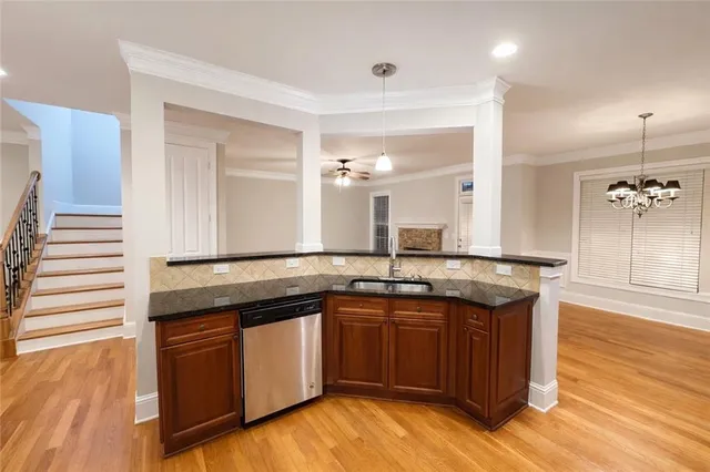 a kitchen with a sink and cabinets