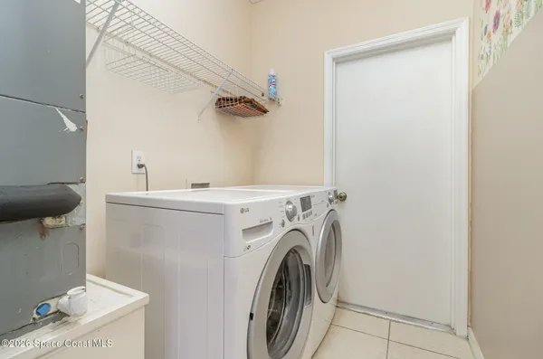 a utility room with dryer and washer
