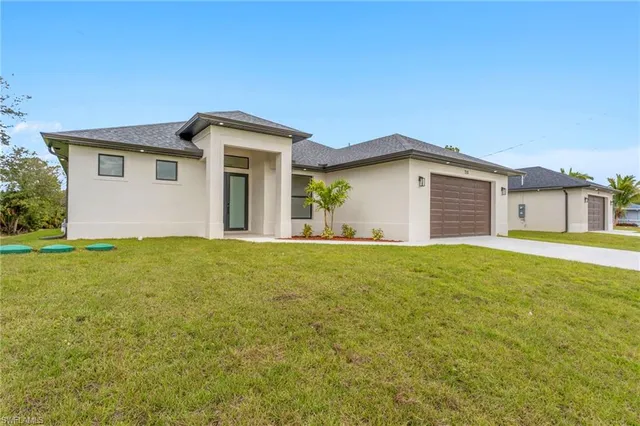 $419,900 | 715 Theodore Vail Street East, Lehigh Acres, FL 33974