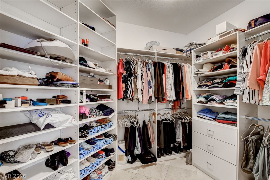 4453 Rometta Avenue Las Vegas, NV 89141 - Photo 20 of 76 Primary walk in closet with organizer system