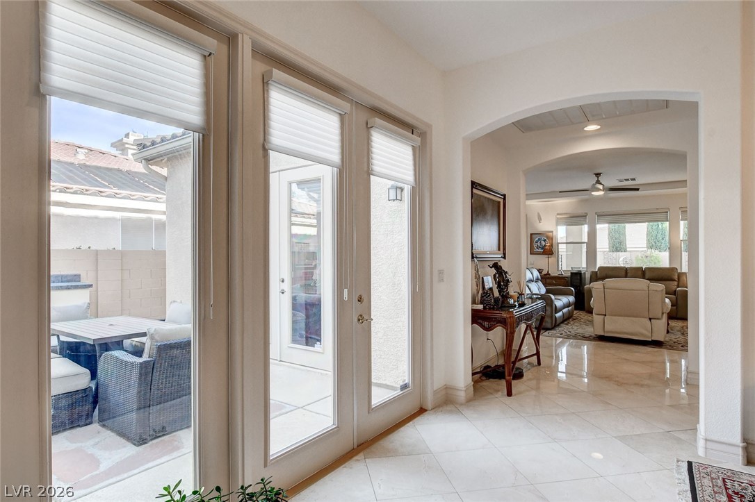 4453 Rometta Avenue Las Vegas, NV 89141 - Photo 34 of 76 French doors leading to the interior courtyard with built in grill