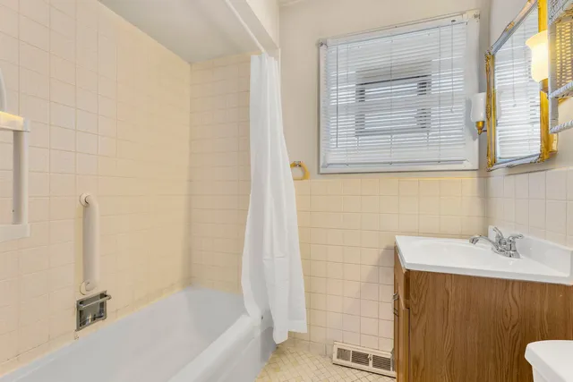 a bathroom with a sink a bathtub and a shower