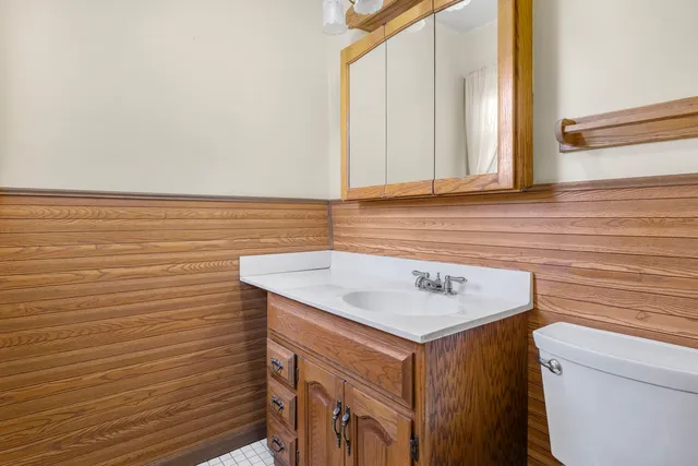 a view of bathroom with a sink and a mirror