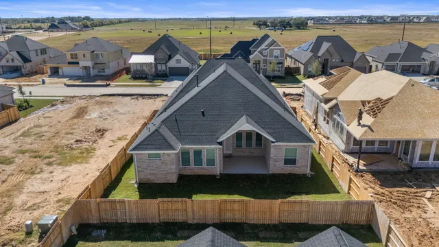 a view of a house with wooden deck