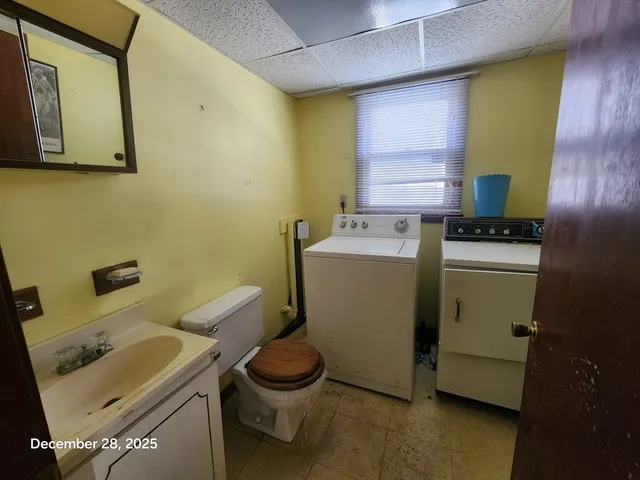 a utility room with dryer and washer