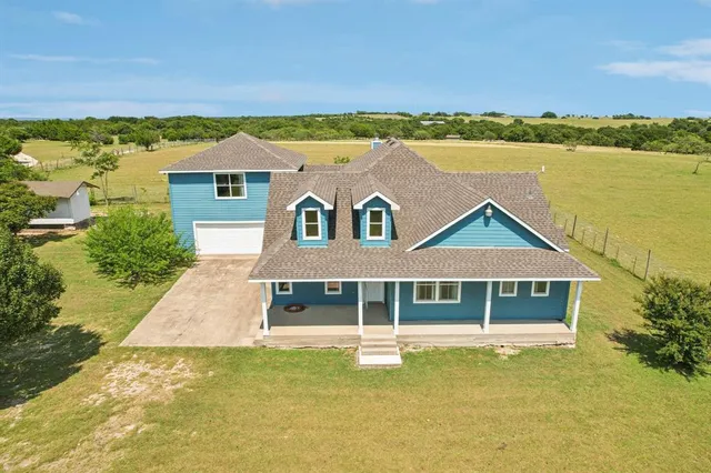 a view of a house with a ocean view