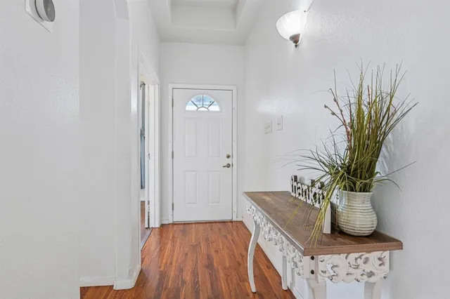 a view of a hallway with potted plant