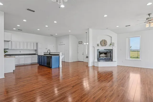 a view of kitchen with cabinets and wooden floor