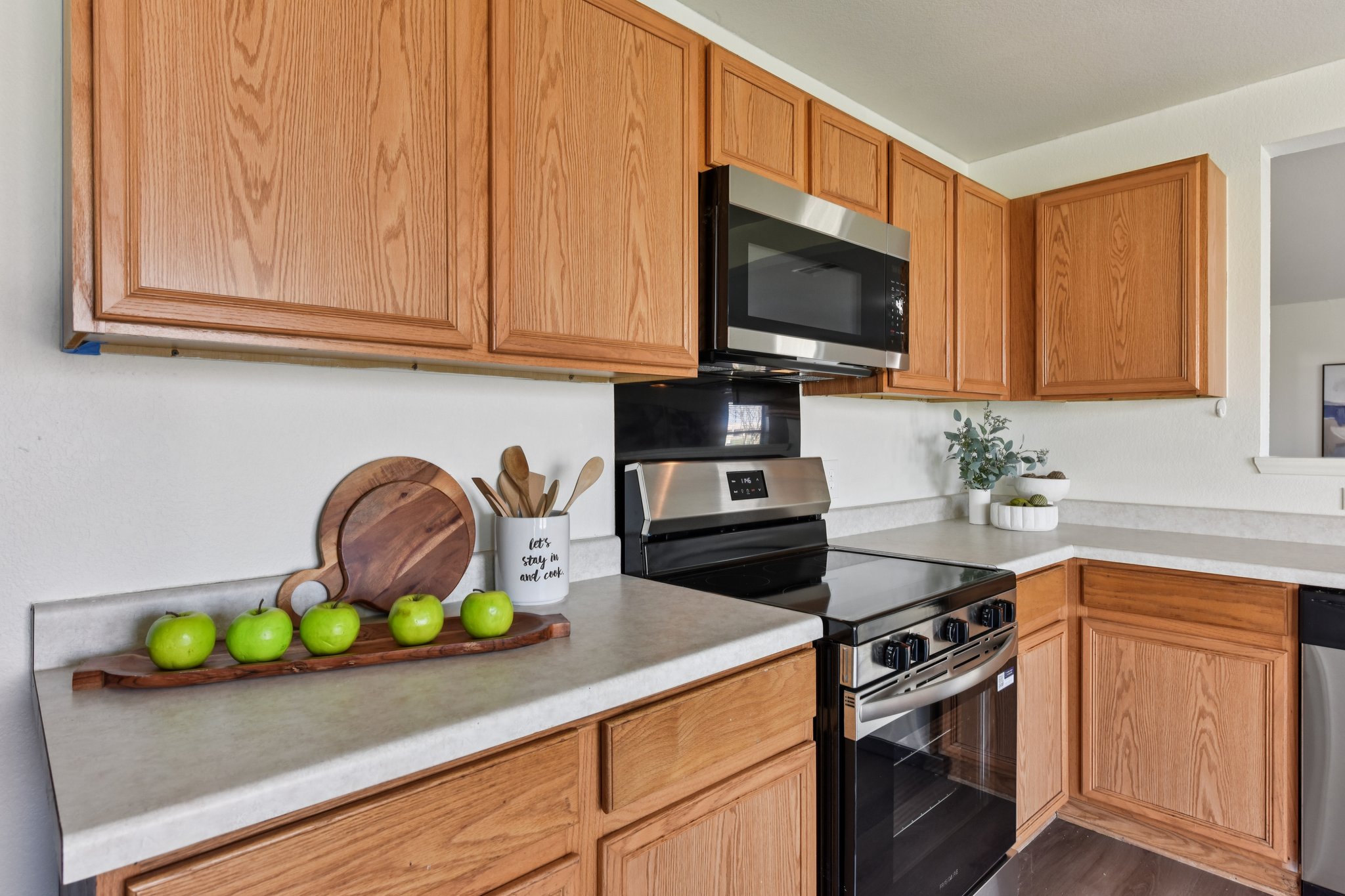 101 Bandara Woods Boulevard Elgin, TX 78621 - Photo 14 of 30 Kitchen with stainless steel appliances and light countertops