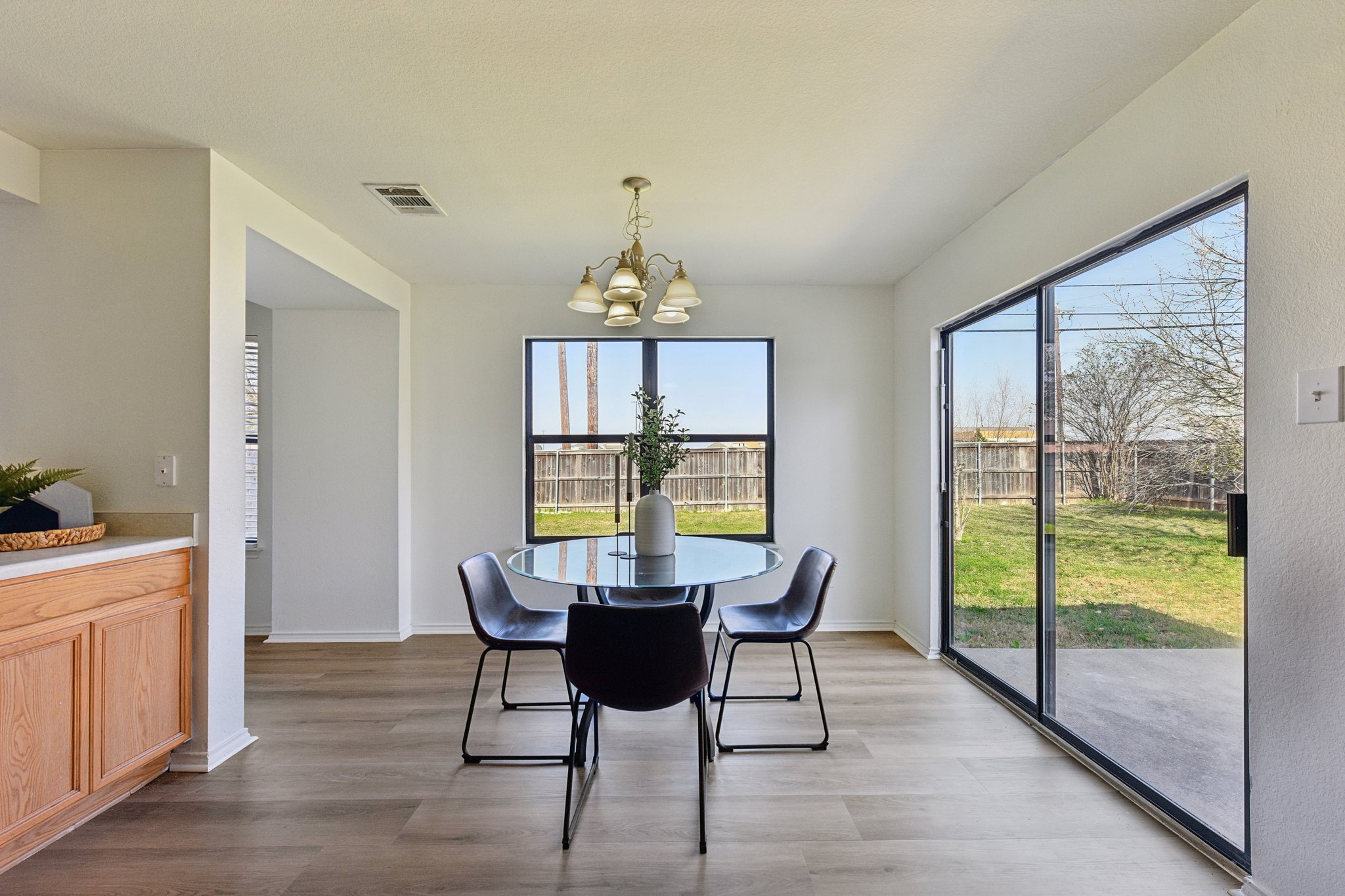 101 Bandara Woods Boulevard Elgin, TX 78621 - Photo 15 of 30 Dining room featuring a chandelier and wood finished floors