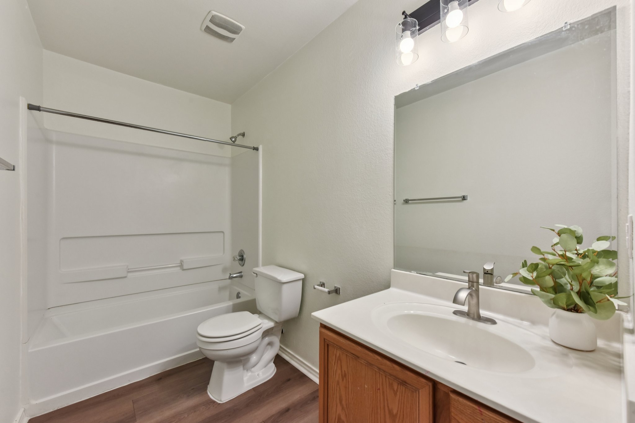 101 Bandara Woods Boulevard Elgin, TX 78621 - Photo 20 of 30 Full bath with vanity, shower / washtub combination, and dark wood-type flooring