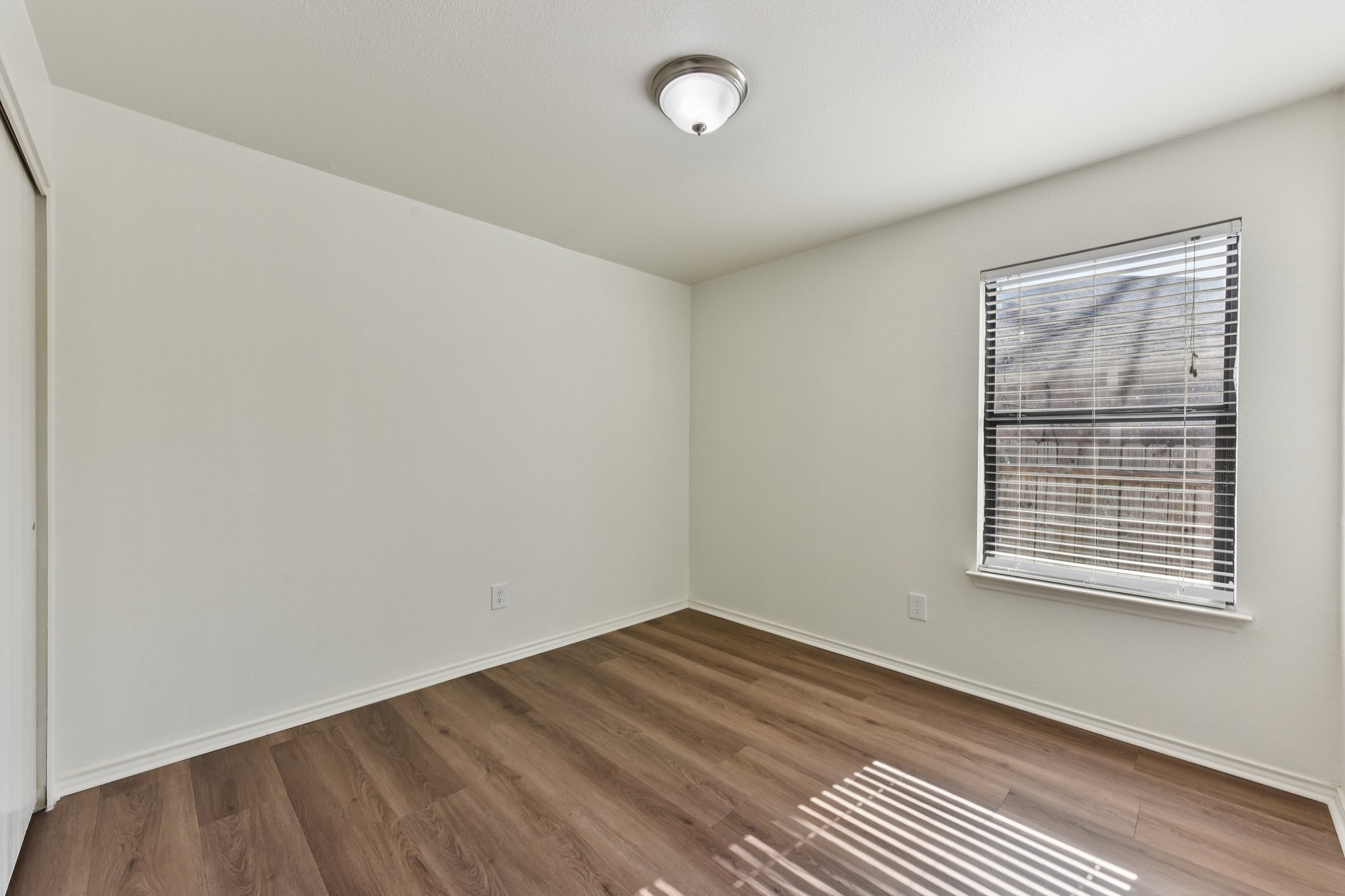 101 Bandara Woods Boulevard Elgin, TX 78621 - Photo 21 of 30 Spare room with dark wood-type flooring and baseboards