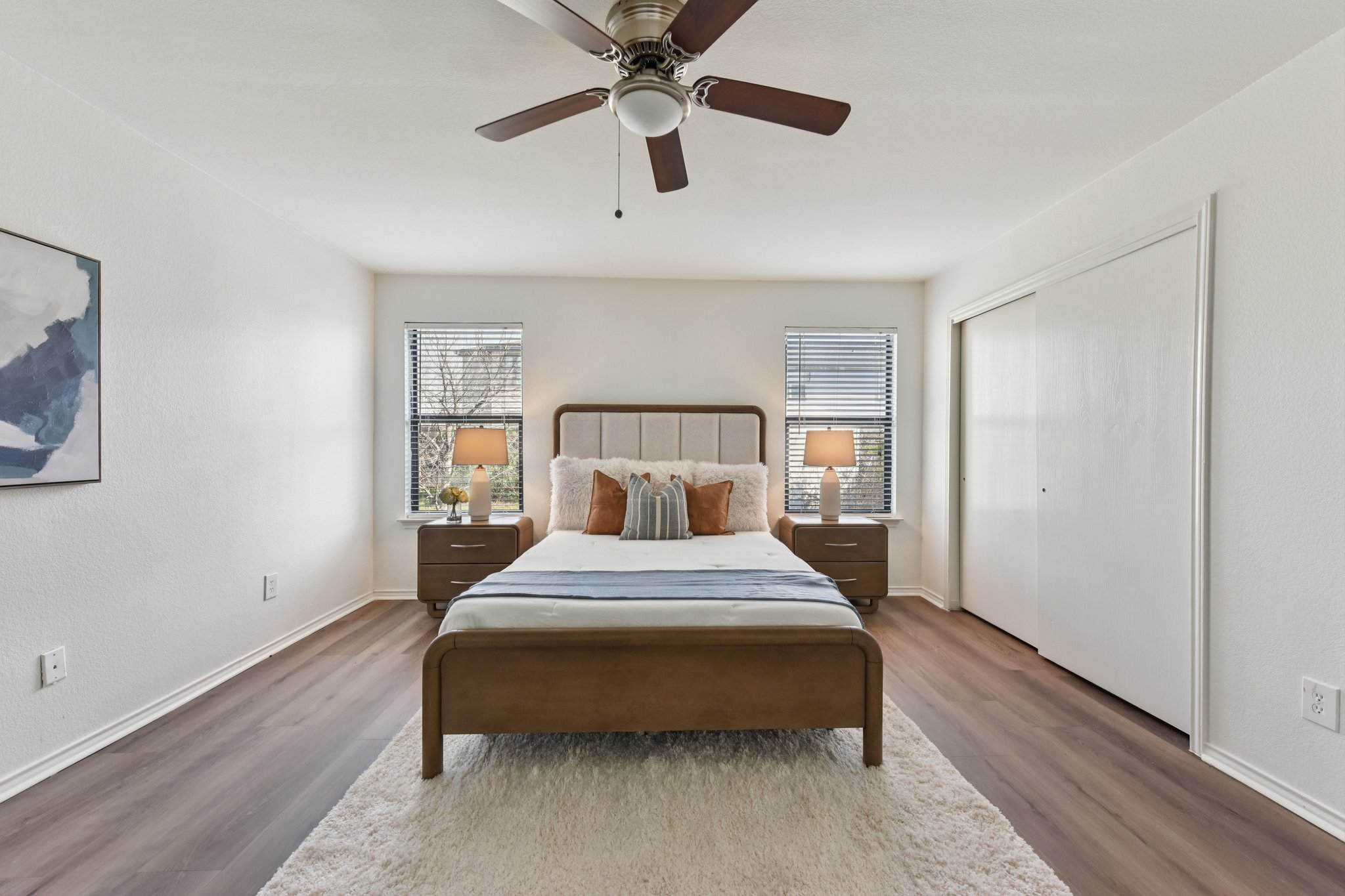101 Bandara Woods Boulevard Elgin, TX 78621 - Photo 23 of 30 Bedroom with a ceiling fan, dark wood-style floors, multiple windows, and a closet