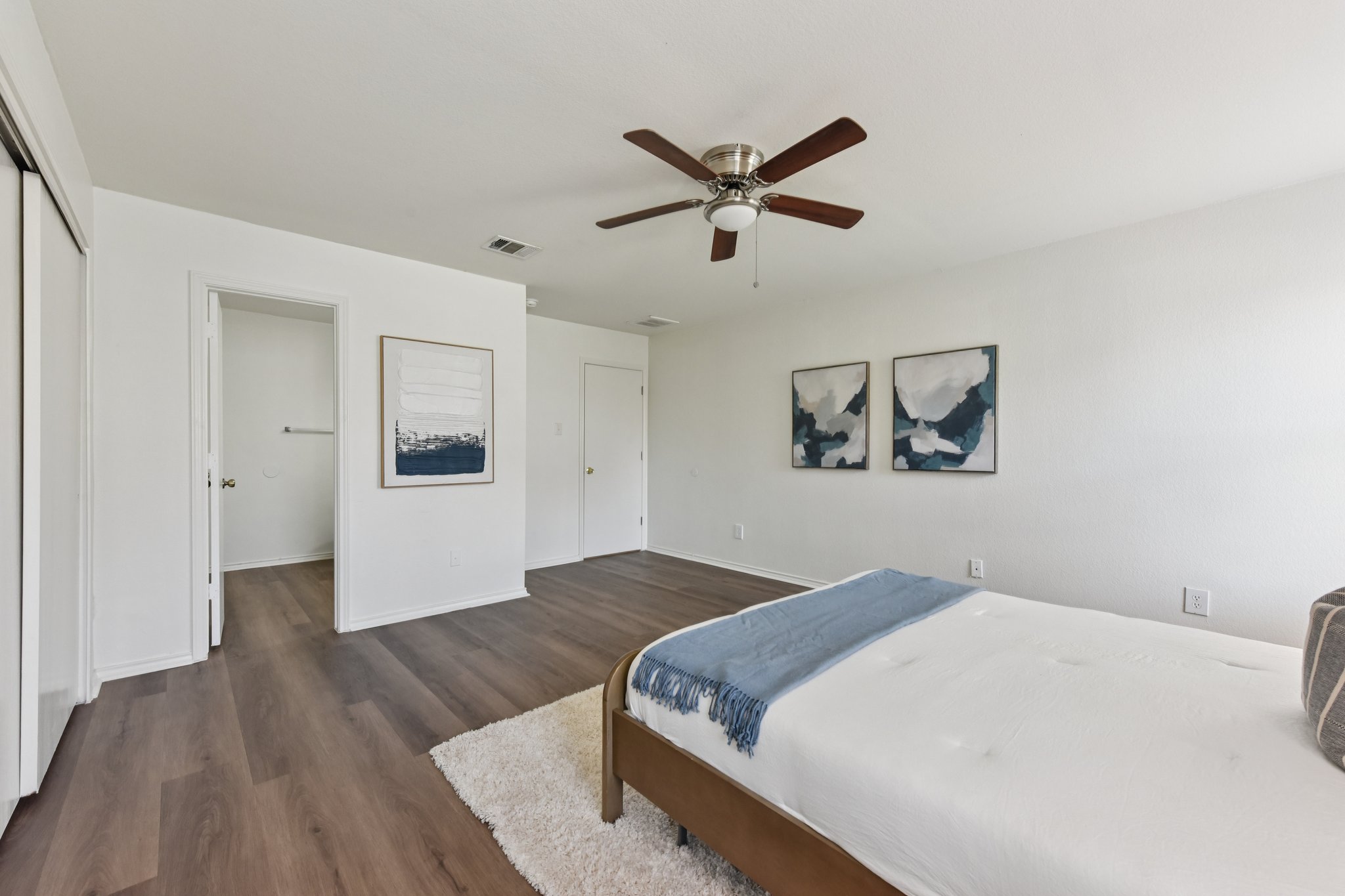 101 Bandara Woods Boulevard Elgin, TX 78621 - Photo 24 of 30 Bedroom with dark wood-type flooring, ceiling fan, and a closet