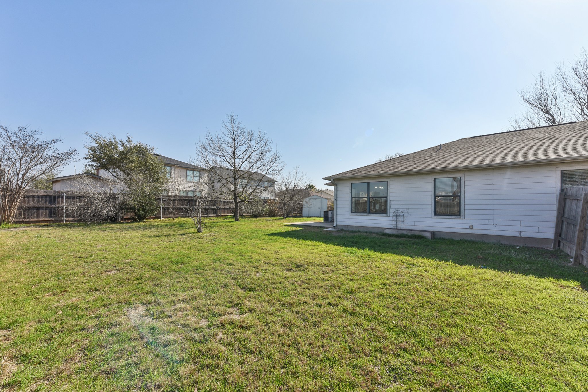 101 Bandara Woods Boulevard Elgin, TX 78621 - Photo 28 of 30 Fenced backyard with a storage shed