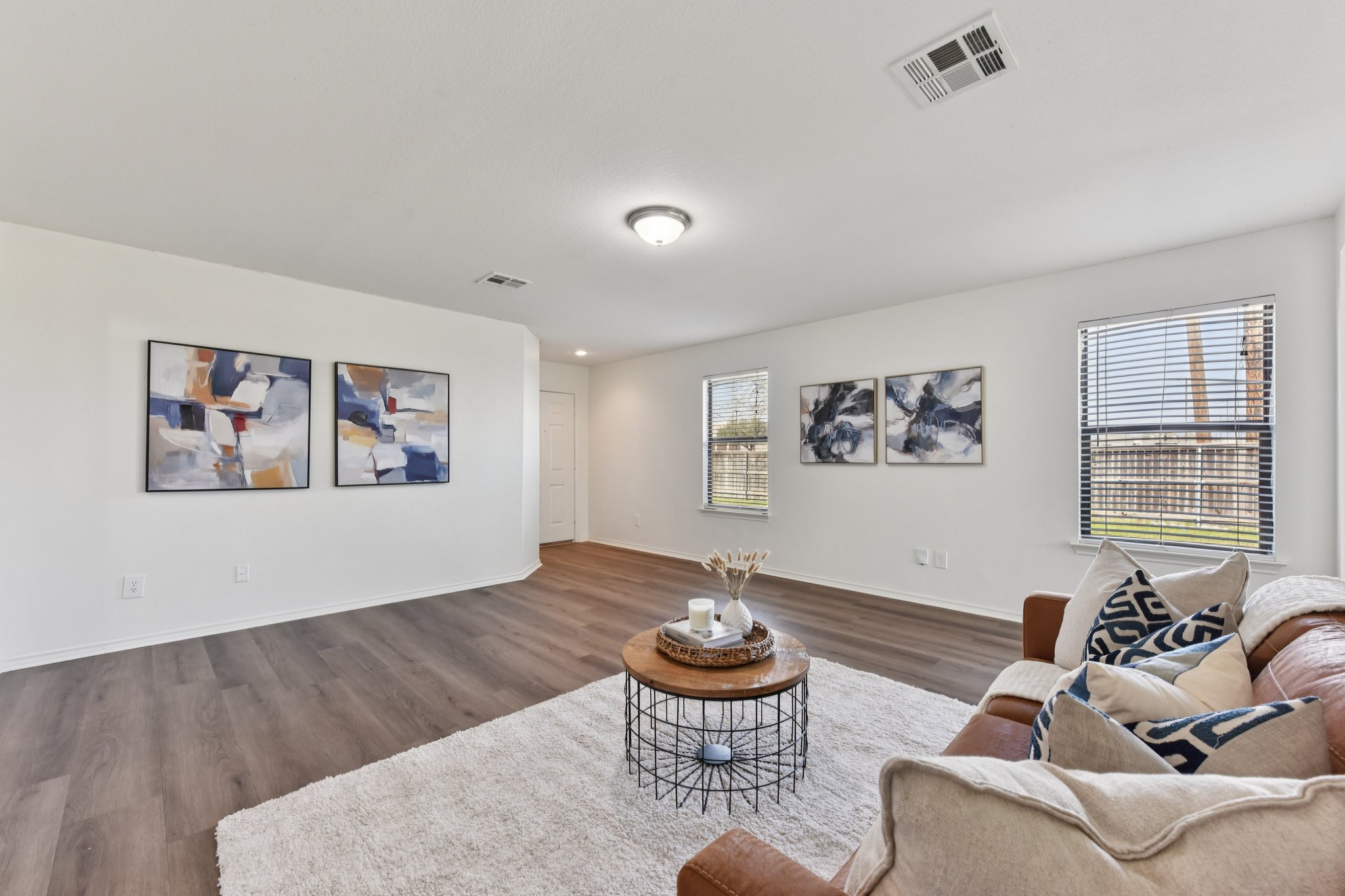101 Bandara Woods Boulevard Elgin, TX 78621 - Photo 8 of 30 Living area with dark wood-style floors and baseboards