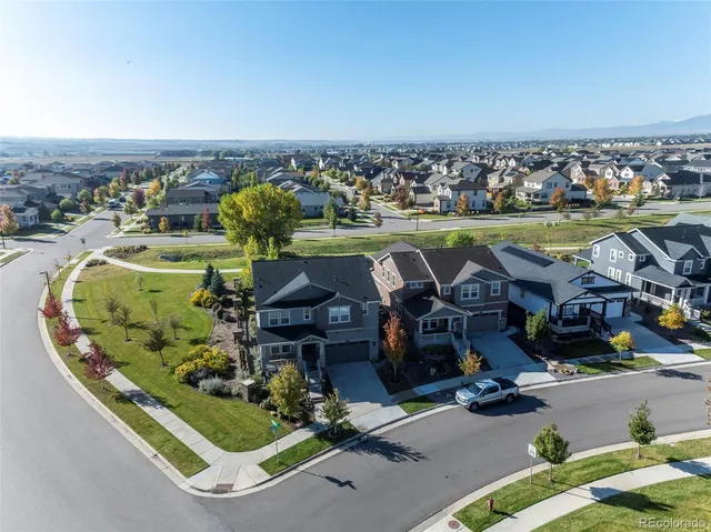 an aerial view of a house with a yard lake view