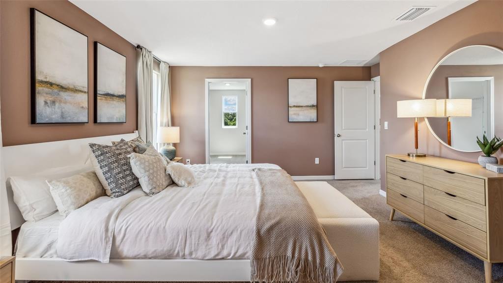 3322 Bitterroot Lane Lakewood Ranch, FL 34211 - Photo 13 of 50 a bedroom with a large bed and a window