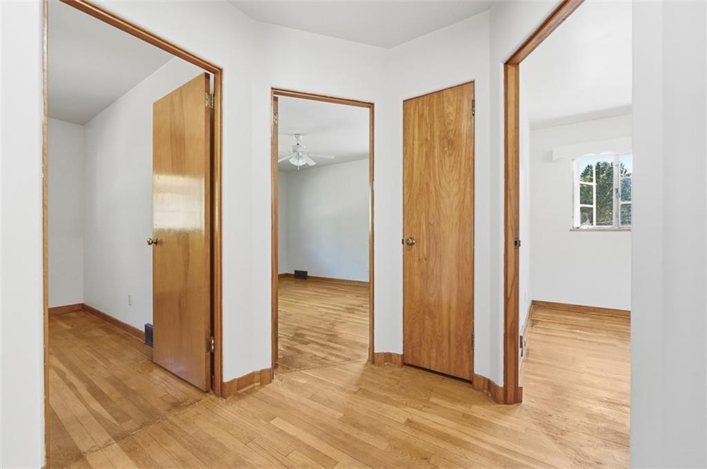 524 McElheny Road Glenshaw, PA 15116 - Photo 14 of 41 a view of a livingroom with wooden floor and a hallway