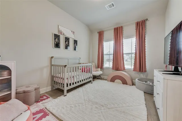a bedroom with furniture and a window