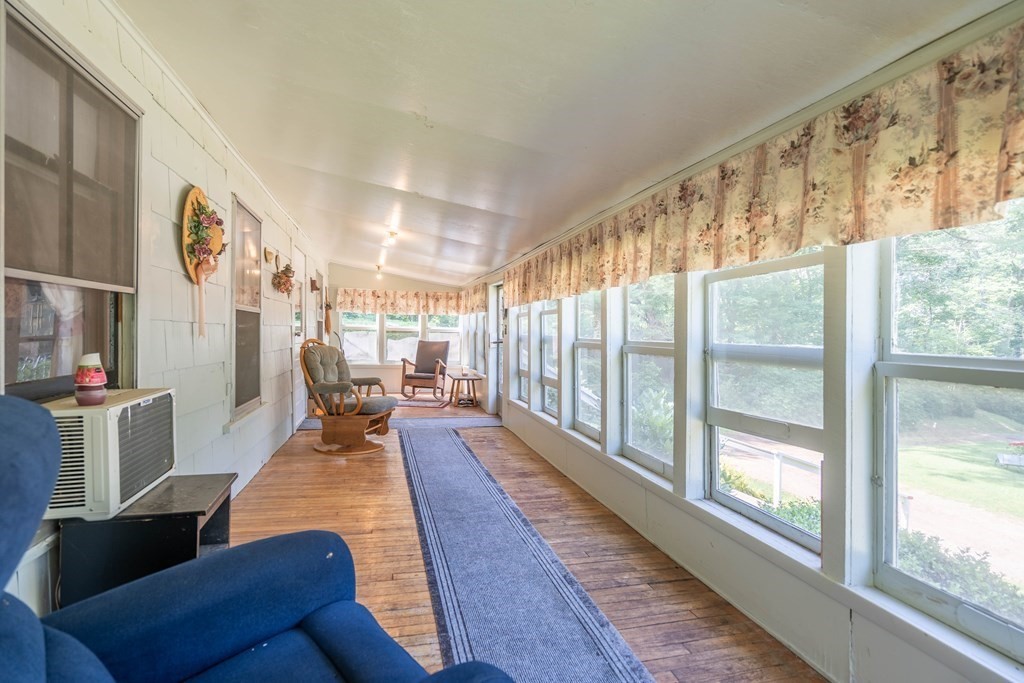 607 Podunk Road East Brookfield, MA 01515 - Photo 13 of 42 a living room with furniture and a large window