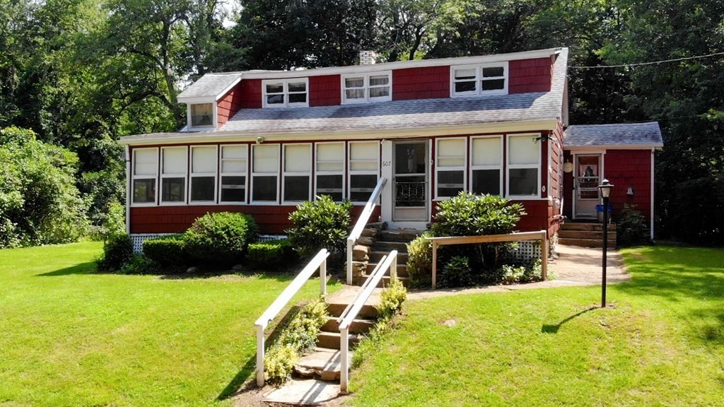 607 Podunk Road East Brookfield, MA 01515 - Photo 28 of 42 a front view of a house with garden