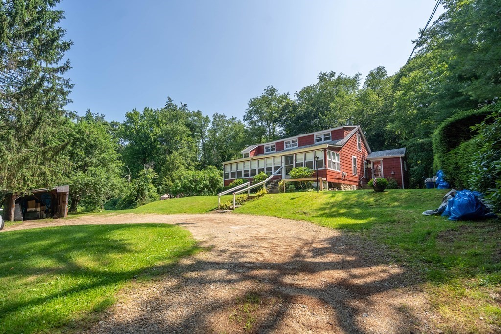 607 Podunk Road East Brookfield, MA 01515 - Photo 29 of 42 a view of a house with garden and trees