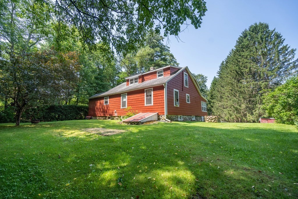 607 Podunk Road East Brookfield, MA 01515 - Photo 3 of 42 a backyard of a house with seating space