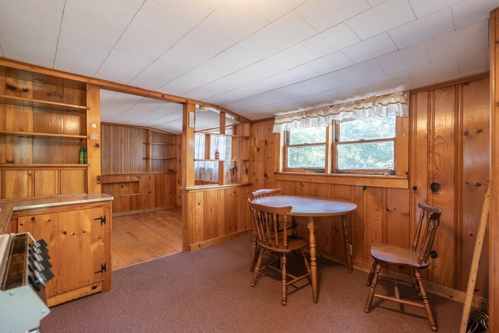 607 Podunk Road East Brookfield, MA 01515 - Photo 8 of 42 a dining room with furniture and window