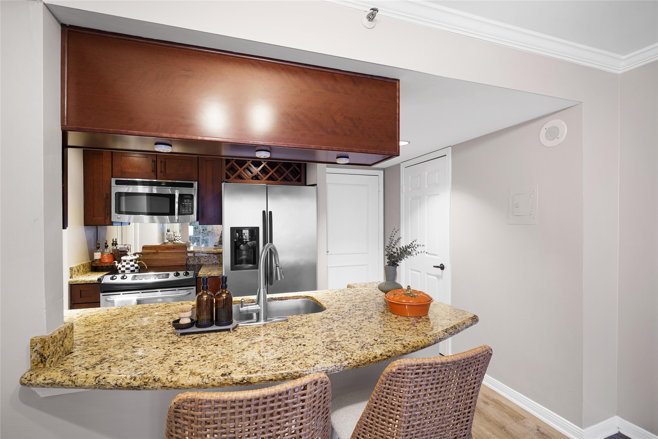 3525 Sage Road, Unit 1612 Houston, TX 77056 - Photo 5 of 8 a kitchen with stainless steel appliances granite countertop a sink and a refrigerator
