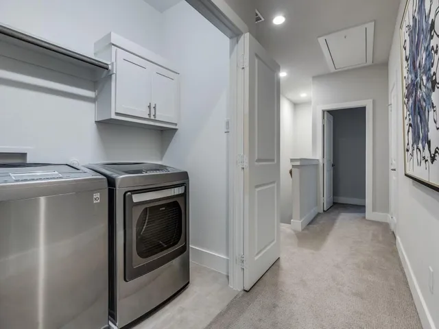 a view of a kitchen with washer and dryer
