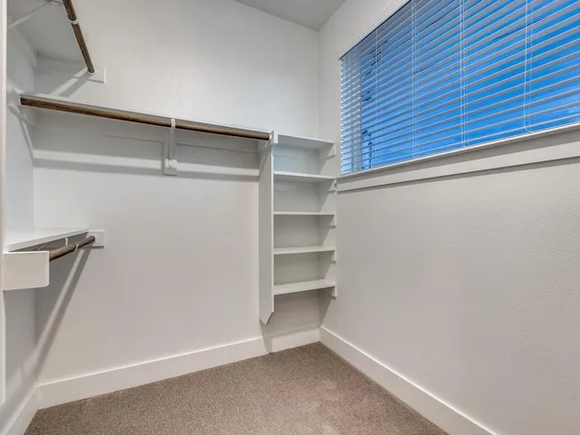 a view of an empty walk in closet