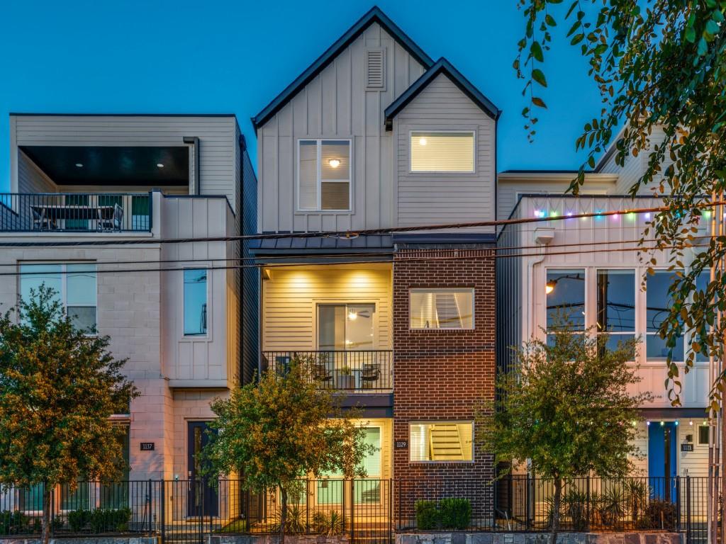 1129 Manderly Court Dallas, TX 75204 - Photo 33 of 33 View of front of property featuring a balcony, a fenced front yard, board and batten siding, brick siding, and a standing seam roof