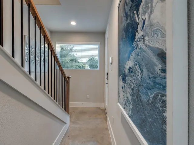 a view of a hallway view with staircase