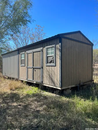 a view of a yard with a tree