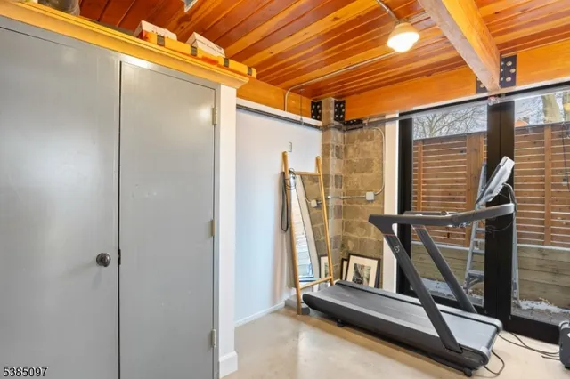 a bathroom with a granite countertop sink mirror vanity and toilet